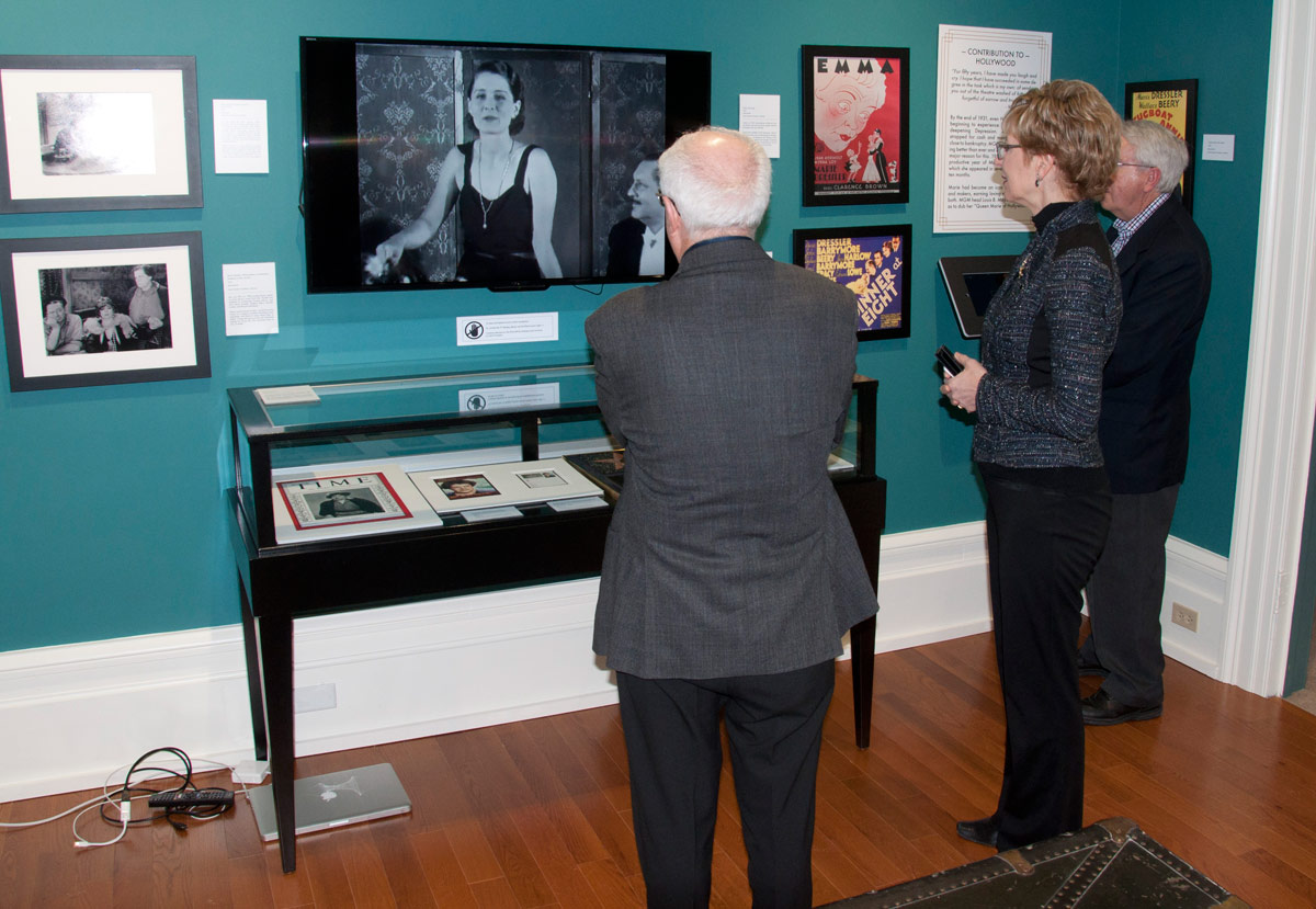 Lou Rinaldi and Minister Daiene Vernile watching one of Museum's exhibits