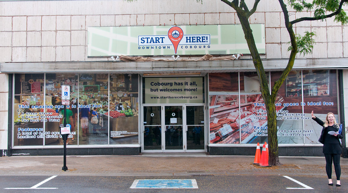 Start Here banner over Sarby's old sign