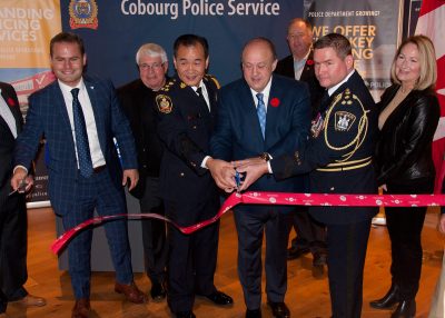 MPP Piccini, Police Chiefs and Minister Tibollo symbolically cutting red tape