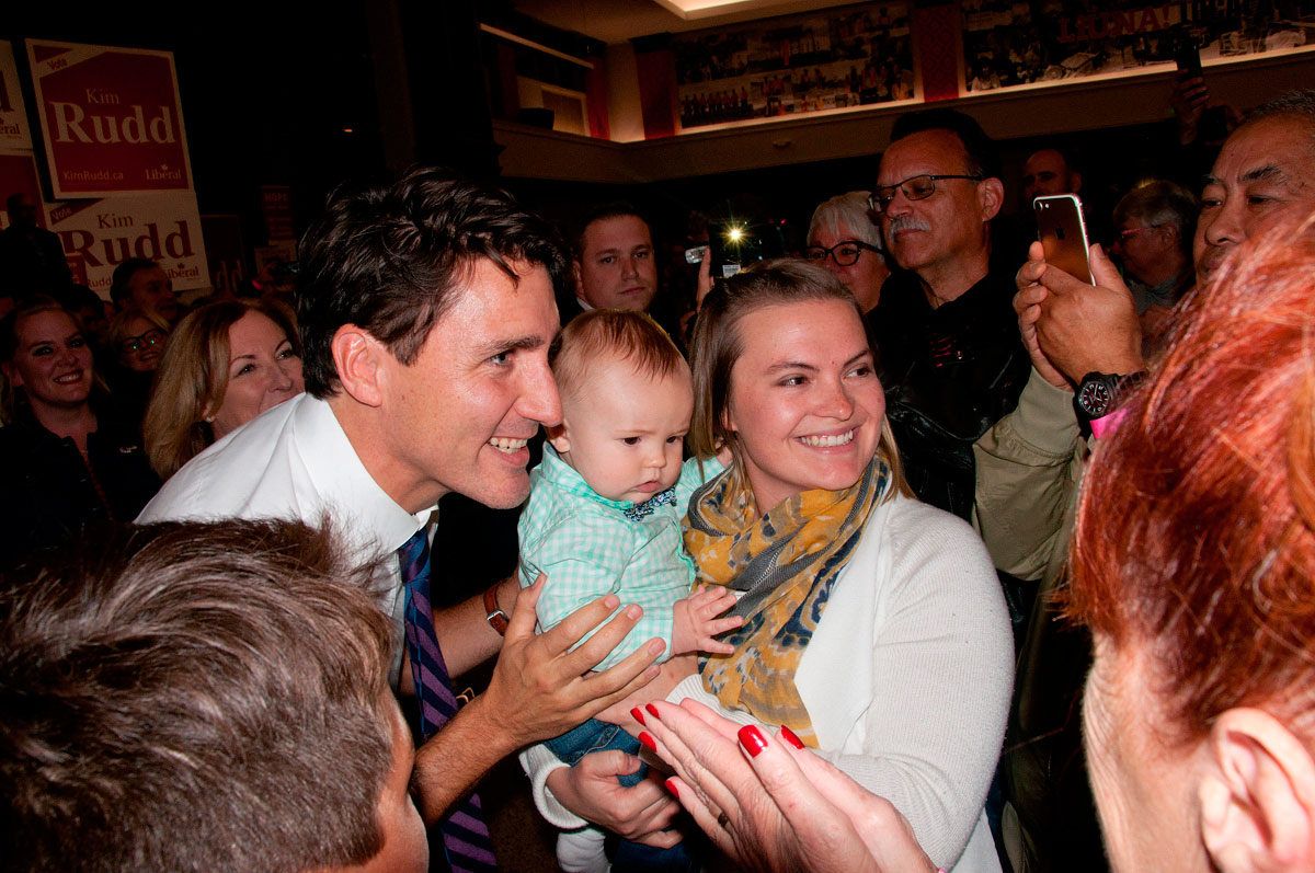 Justin Trudeau with happy mother and baby